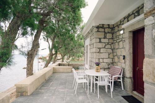 Emporios Apartment | Emporios 1930, Seafront stone house