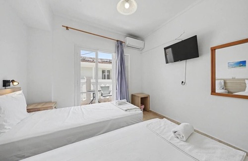 Kavos Bed & Breakfast | Bed and Breakfast 'The Kavos Sandy Inn-Double Room' with Shared Pool, Wi-Fi and Air Conditioning
