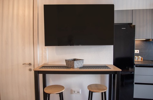 Vivlos Apartment | Næxon Vivlos Grey Roof Apartment with Shared Terrace, Wi-Fi and Air Conditioning