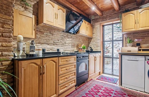 Kerameikos House | Olvion House: rustic stone retreat in Athens with a cozy private courtyard.