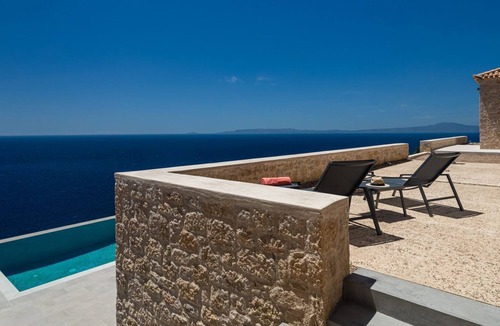 Kardamyli Villa | R 3056 Villa Fabiola Closet, Fireplace & Soundproof Windows.