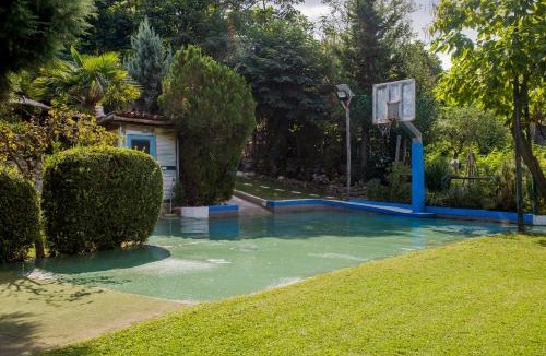 Tragilos House | Roxani Aqua Bliss - Serene Garden Getaway