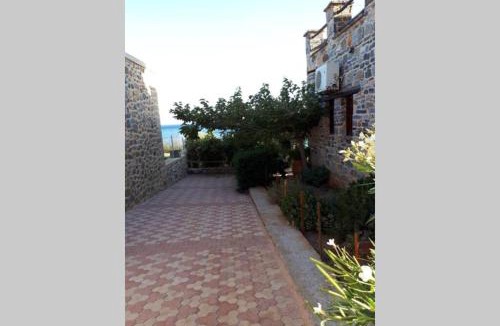 Gortyna House | Traditional stone house by the sea.