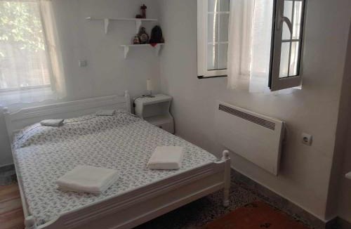 Karlovassi Apartment | white & stone home