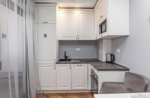 Bar Apartment | XIO Apartments | Stylish Comfort with Balconies & Full Kitchens