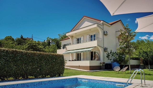 Captivating 4BD Villa with Outdoor Pool and Garden