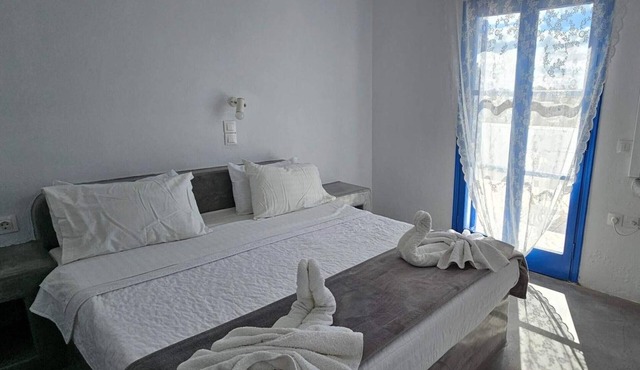 Classic Quadruple Room 1 with Balcony and Air Conditioning in Perissa