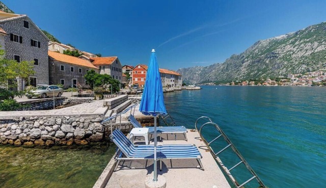 Historic waterfront house near Kotor with a private swimming pier