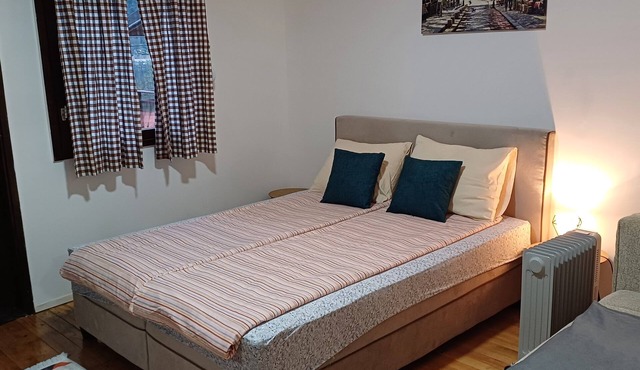 In a quiet part of the city, with a free parking space and a private terrace.