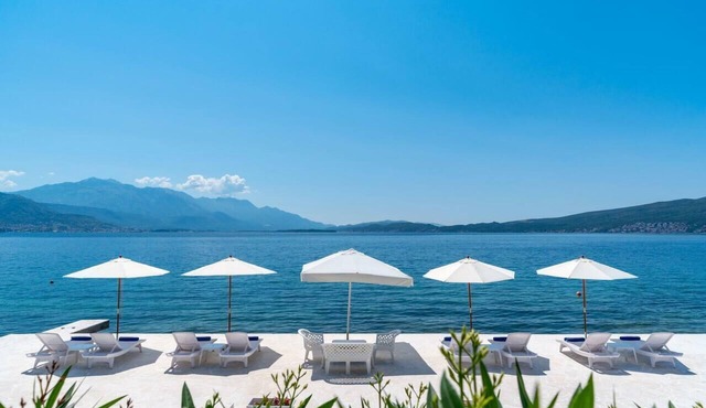 Luxury beachfront villa with private beach and relaxation area