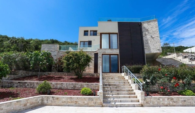 Luxury villa on the first line with a private beach and 2 pools