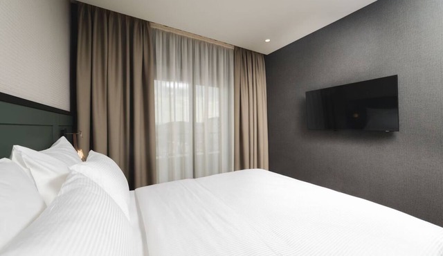 Relax in Spacious Room w/Balcony, City view & Free Parking in Prime location!