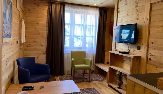 The Ski Suite has one bedroom and a small living room with no kitchen.