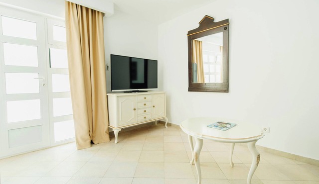 Yellow 1-bedroom apartment with AC in vibrant Budva